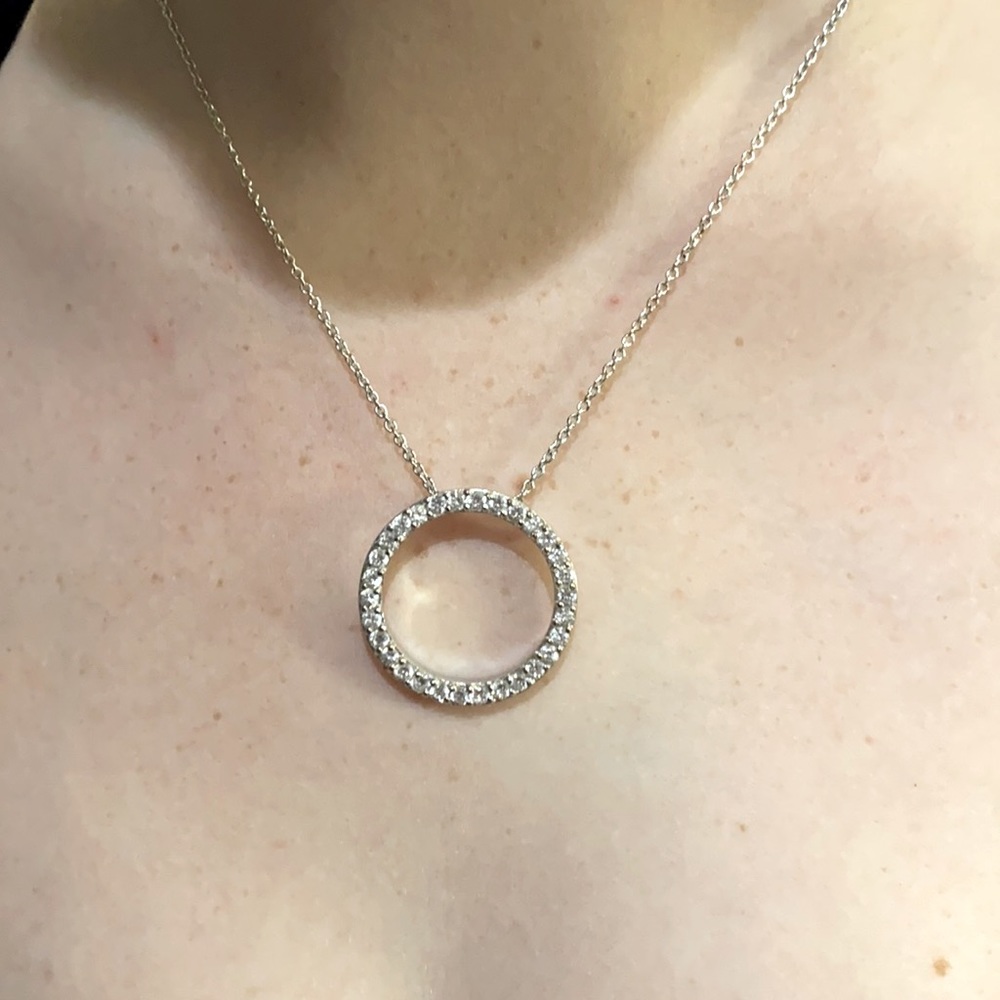 Silver tone necklace with circle pendant